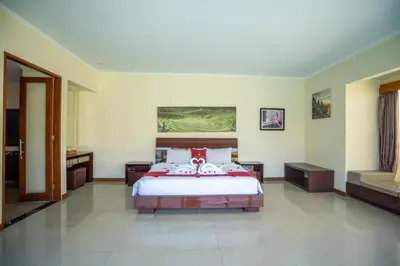 a bedroom with a large bed in a room at 1-BR Private Pool Villa Seminyak Kunti St in Seminyak