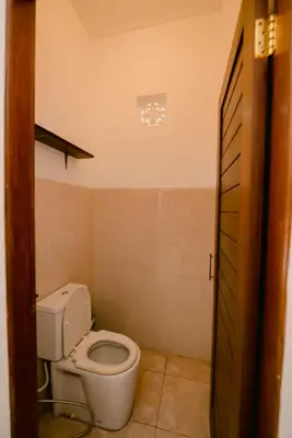 a bathroom with a toilet in a room at Amazing 2 Bedroom Villa 5 Min To The Beach - Durna Villa in Canggu