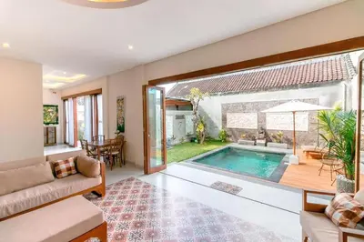 a living room with a swimming pool in a house at Villa Shantia by Bby Diamond in Legian