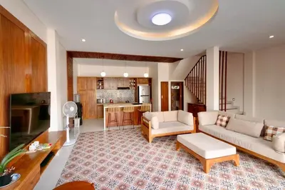 a living room with a couch and a table at Villa Shantia by Bby Diamond in Legian