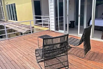 two chairs and a table on a balcony at Elegant 5 Bdr villa in the heart of Seminyak in Seminyak