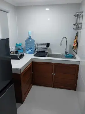 a kitchen with a sink and a counter top at Thula Thula Bali Villas in Kerobokan