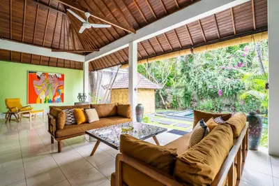 a living room with a couch and a table at Villa Amaro Seminyak in Seminyak