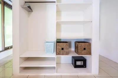 a walk in pantry with baskets and shelves at Villa Amaro Seminyak in Seminyak