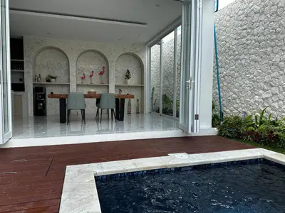 a house with a swimming pool in the middle of a patio at newly built Villa Na Bali in Seminyak