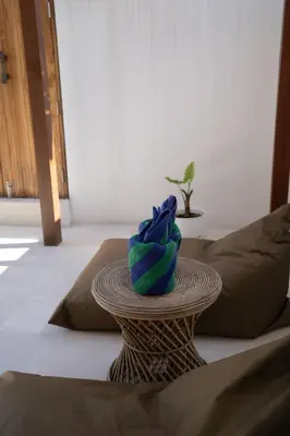 a table with a blue towel on top of it at Villa Bohemian Seminyak in Seminyak