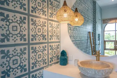 a bathroom with a sink and a mirror at Villa Bohemian Seminyak in Seminyak