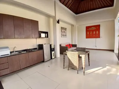 a kitchen and dining room with a table and chairs at Villa Putri in Seminyak Bali in Seminyak