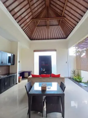 a living room with a couch and a table at Villa Putri in Seminyak Bali in Seminyak