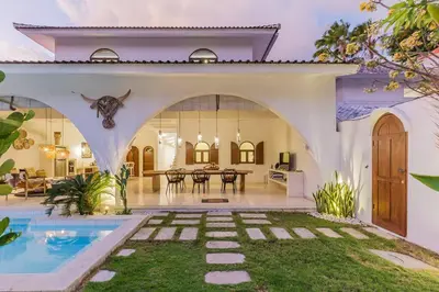 a villa with a swimming pool and a house at 3 bedr Mediterranean vibes private pool 5min beach in Seminyak