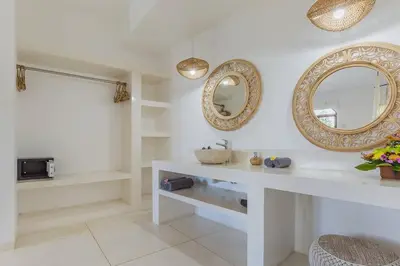 a white bathroom with a sink and a mirror at 3 bedr Mediterranean vibes private pool 5min beach in Seminyak