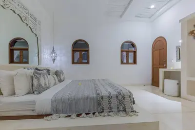 a white bedroom with a large bed in a room at 3 bedr Mediterranean vibes private pool 5min beach in Seminyak
