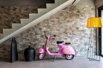 a pink scooter is parked in a room at Atelier 1Br Villas in Seminyak in Seminyak