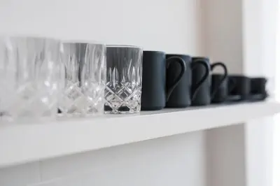 a white shelf with wine glasses on it at Gorgeous 2 Bed Pool Villa, Walk to Seminyak Beach in Seminyak