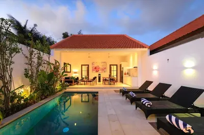 a backyard with a swimming pool and a house at Gorgeous 2 Bed Pool Villa, Walk to Seminyak Beach in Seminyak
