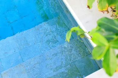 a close up of a blue swimming pool at Gorgeous 2 Bed Pool Villa, Walk to Seminyak Beach in Seminyak