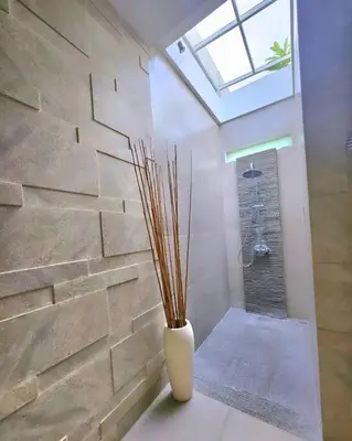 a white vase sitting on a table in a room at Nikaya Villa - 3 Bedrooms Near Seminyak in Legian