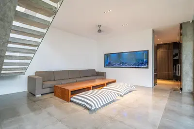 a living room with a couch and a table at Villa Simpatico Spacious 6 BR Villa Retreat in Central Seminyak in Seminyak