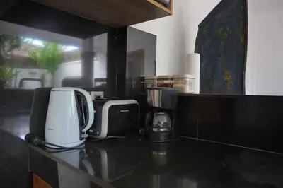 a kitchen counter with two coffins and a coffee maker at T&J1 - Gorgeous 1BR pool villa, parking, walk to beach! in Umalas
