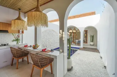 a kitchen with a table and chairs in a room at T&J4 - Romantic 1BR pool villa, walk to beach in Umalas