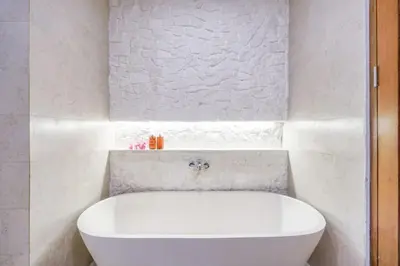 a white bath tub in a white bathroom at T&J5 - New! Romantic 1BR pool villa, walk to beach! in Umalas