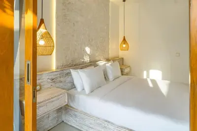 a bedroom with a large white bed with white pillows at T&J5 - New! Romantic 1BR pool villa, walk to beach! in Umalas