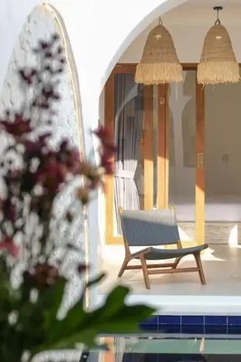 a bench sitting on the side of a pool at T&J6 - Gorgeous 1BR pool villa, walk to beach! in Umalas