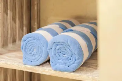 a bunch of rolled towels on a shelf at T&J6 - Gorgeous 1BR pool villa, walk to beach! in Umalas