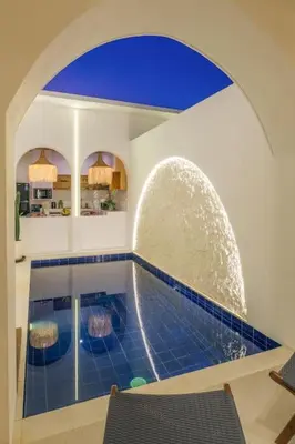 a room with a swimming pool with a blue tile floor at T&J6 - Gorgeous 1BR pool villa, walk to beach! in Umalas