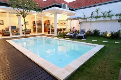 a swimming pool in the backyard of a house at 2 villa complex near Atlas beach in Canggu