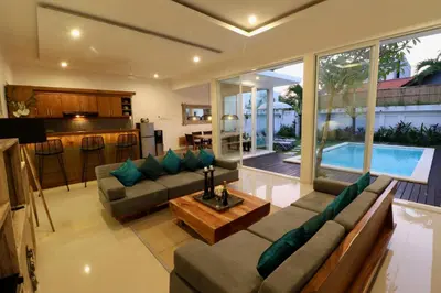 a living room with a couch and a table at 2 villa complex near Atlas beach in Canggu