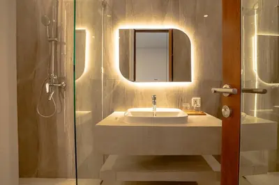 a bathroom with a sink and a shower at Miles Coliving in Kerobokan