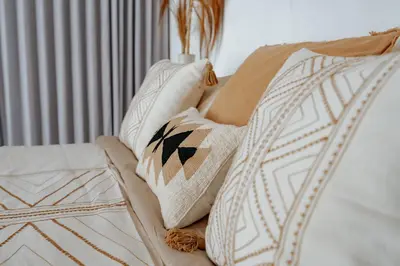 a bed with pillows on it with at Villa bossa nova in Seminyak