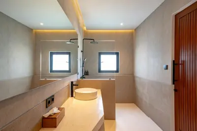 a bathroom with a sink and a mirror at Casa Umari in Canggu