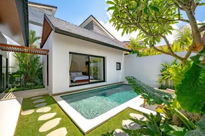 a pool in the backyard of a villa at Casa Umari in Canggu