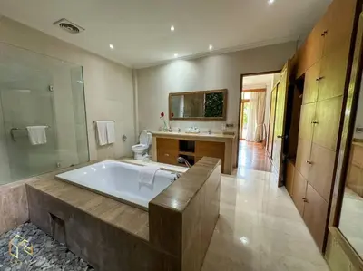 a large bathroom with a tub and a sink at Party Size 4 Bedroom Villa Kerobokan in Seminyak