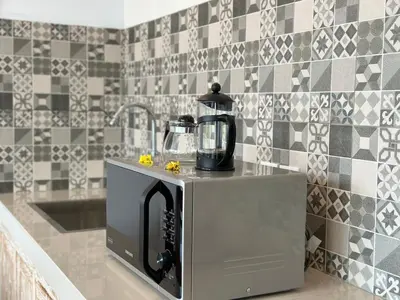 a kitchen with a blender on top of a counter at 2 bedrooms villa cinta umalas in Kerobokan