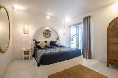 a bedroom with a bed and a large window at The Hepburn Seminyak ADULTS ONLY Chic Boutique Room with Pool 900m Walk to Beach in Seminyak