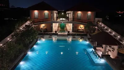 an overhead view of a swimming pool at night at SOLTERRA SEMINYAK Boutique Hotel & Spa Powered by Archipelago in Seminyak