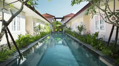 a swimming pool in the courtyard of a building at SOLTERRA SEMINYAK Boutique Hotel & Spa Powered by Archipelago in Seminyak
