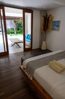 a bedroom with a bed and a sliding glass door at Villa Malya 5 bedrooms Seminyak in Seminyak