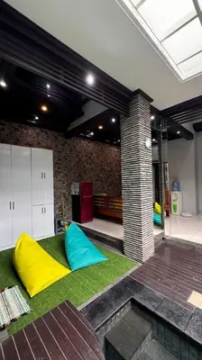 a room with two colored pillows on the grass at MOOvilla 1 Seminyak, Bali in Umalas