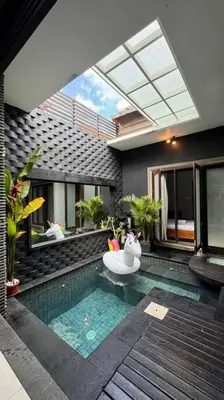 a house with a swimming pool with a bath tub at MOOvilla 1 Seminyak, Bali in Umalas