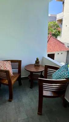 a room with two chairs and a table and a window at Ellenbrook Rooms 17 by Mulia Cottage in Seminyak