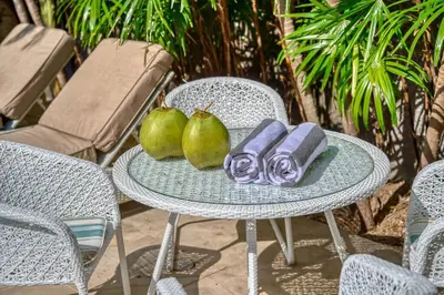 a table with pears and a plate of food on it at Villa Sabi 3BR in the Heart of Seminyak by Santi Management in Seminyak
