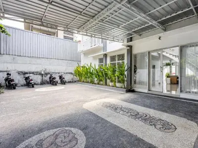 a building with motorcycles parked inside of it at Villa Chunga-changa Double six in Seminyak