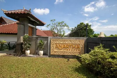 a sign for the entrance to a villa at Anartha Resort Jimbaran By Kubu GWK in Jimbaran