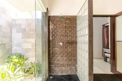 a bathroom with a shower with a glass door at Villa with private pool in Nusa Dua in Nusa Dua