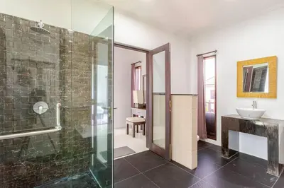 a bathroom with a glass shower and a sink at Villa with private pool in Nusa Dua in Nusa Dua