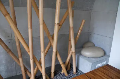 a bunch of wooden baseball bats and a rock at 5BR Villa Sabtu - Minggu Villas Seminyak in Seminyak